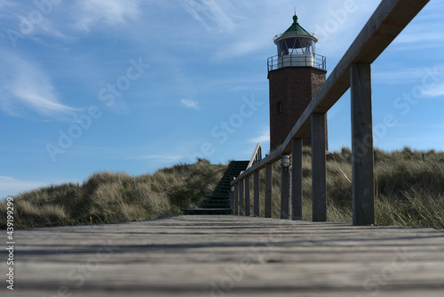 abliefern  sylt  ellenbogen  norddeutschland  nordsee  seemann  see  meer  blau  rot  wei    nachmittag  stimmung  simmungsvoll  leuchtturm  licht  himmel  k  ste  