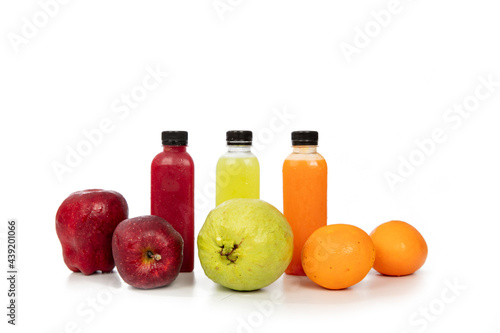 Fresh and Raw furit, Red apple Oranage and Guava on table with juice on background