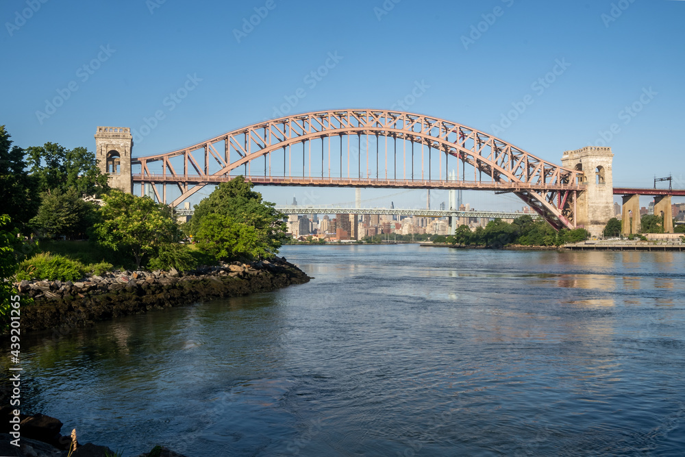 Astoria, NY - USA - June 13, 2021: view of the historic Hell Gate Bridge Astoria, NY - USA - June 13, 2021: view of the historic Hell Gate Bridge