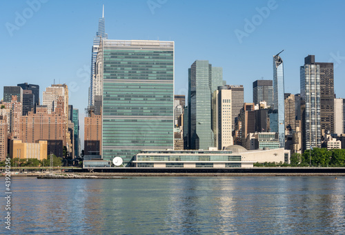 Long Island City, NY - USA - June 13, 2021: Landscape view of the east side of Manhattan. Featuring the Headquarters of the United Nations.