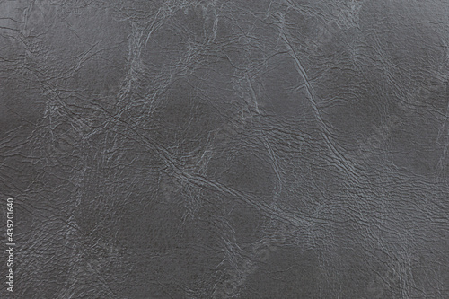 Background image - dark gray leather with textured abstract pattern