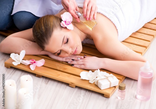 Young woman during spa procedure in salon