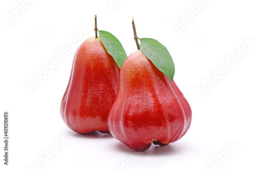 Rose apple or Bell fruit with green leaves isolated on white background