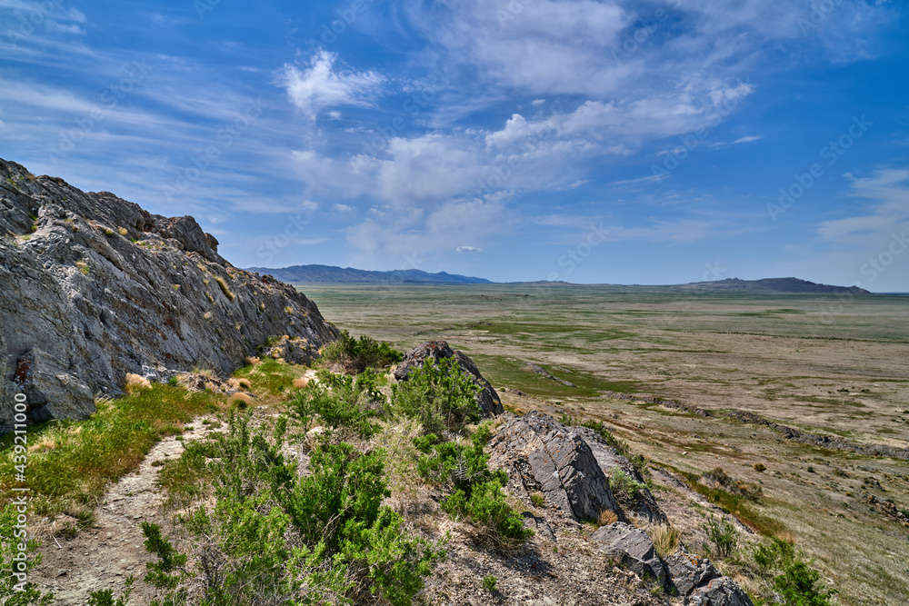 Scenic View of Utah Mountain Rocky landscape with blue skies and white clouds	