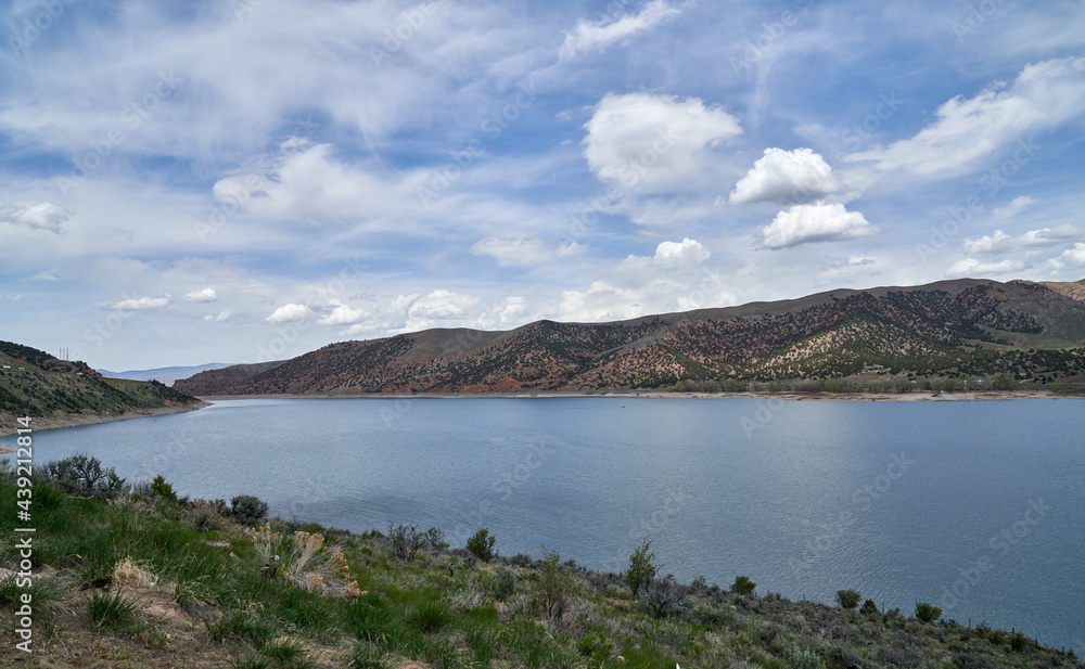 Scenic view of California Lake in the mountains in summer with blue skies and puffy white clouds	