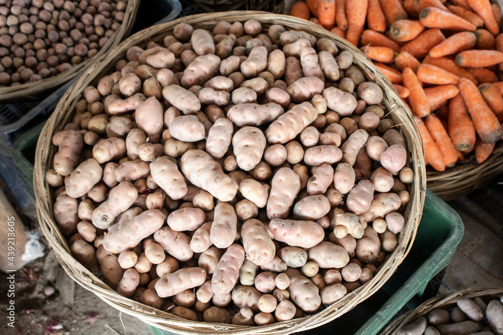 Potatoes, carrots and many kinds of vegetables are arranged in a store Potatoes, carrots and many kinds of vegetables are arranged in a store