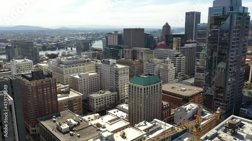 Cinematic drone dolly shot of downtown Portland skyscrapers near Pearl and Lloyd Districts, Nob Hill, Buckman Neighborhood, King's Heights, a beautiful cityscape in Oregon photo