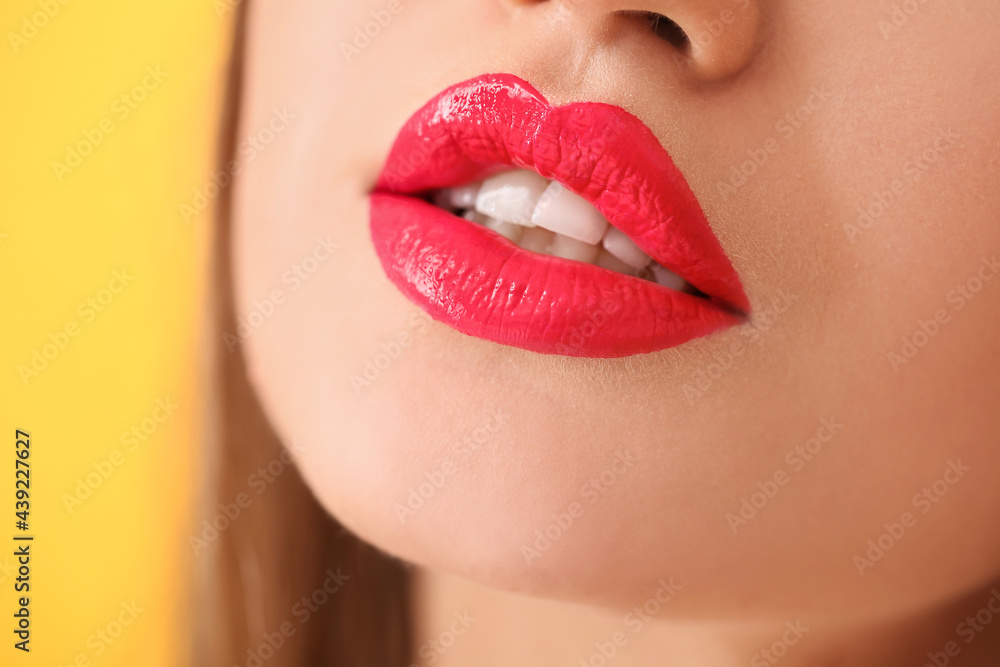 Fototapeta premium Beautiful young woman with bright lipstick, closeup