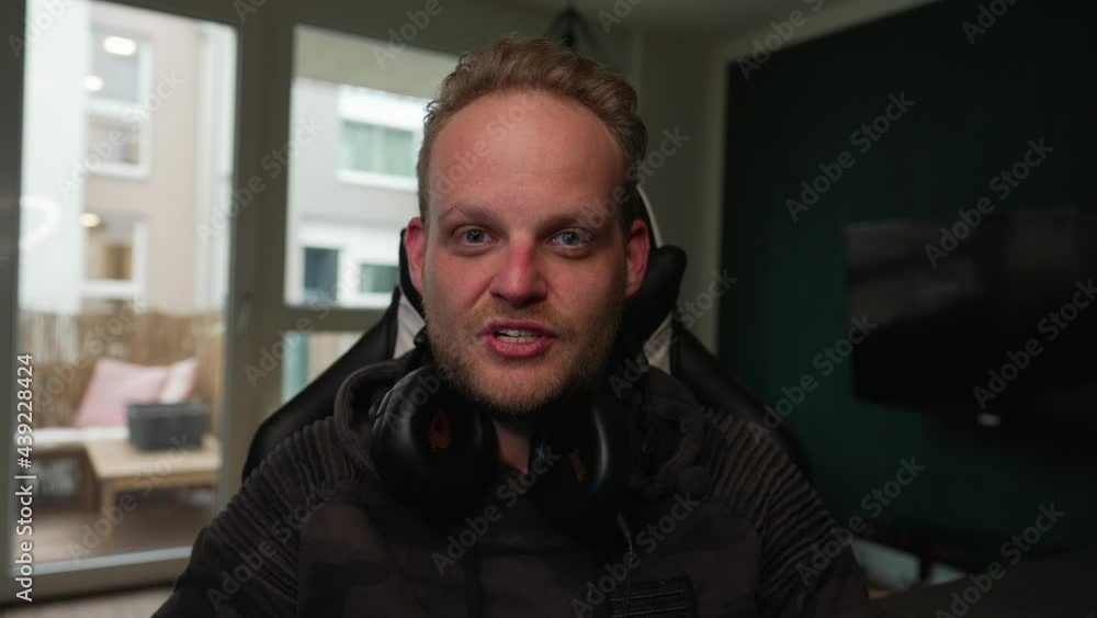 STREAMING - Man takes hand off camera and starts talking, medium shot STREAMING - Man takes hand off camera and starts talking, medium shot