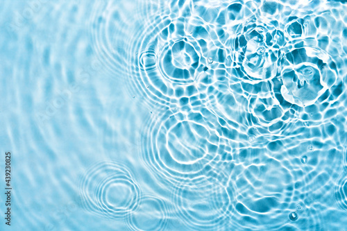 Abstract transparent liquid background with concentric circles and ripples. Spa concept. Soft focus photo