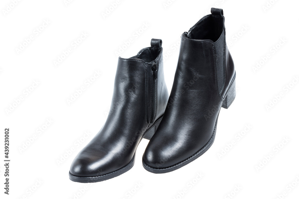 Pair of modern ladies black boots, on white background