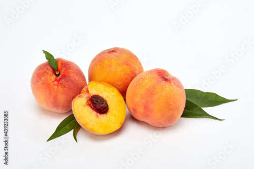 Fresh peaches and leaves