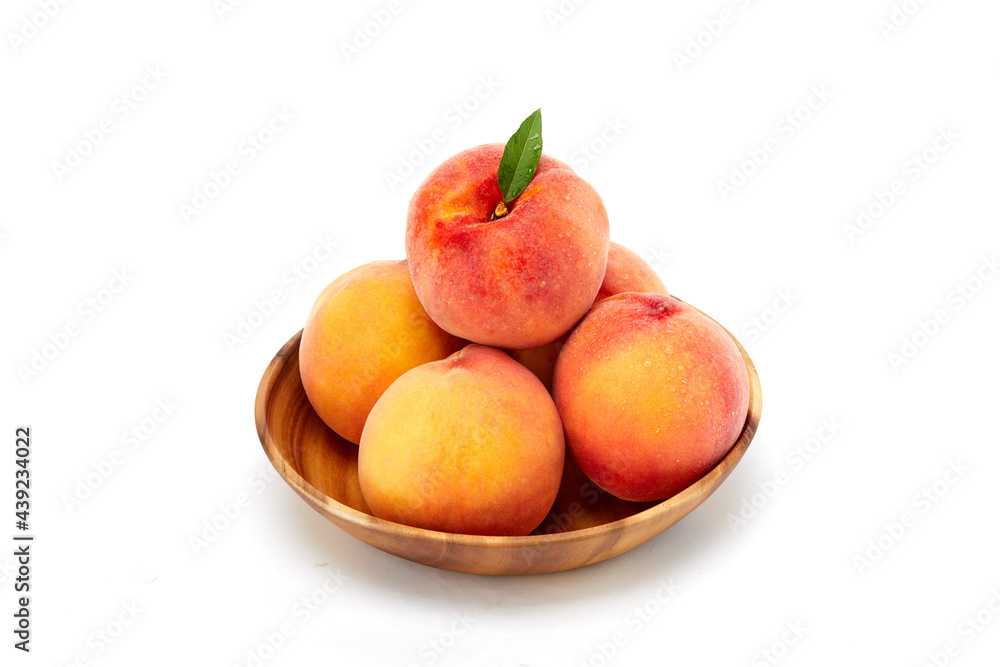 Fresh peaches and leaves Fresh peaches and leaves