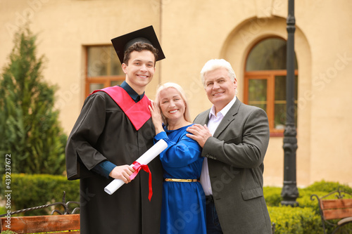 Happy young man with his pa...