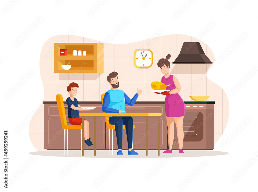 Happy family eating together at kitchen. Mother, father and son celebrate Thanksgiving Day Happy family eating together at kitchen. Mother, father and son celebrate Thanksgiving Day