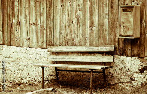 an old bench in the mountains photo