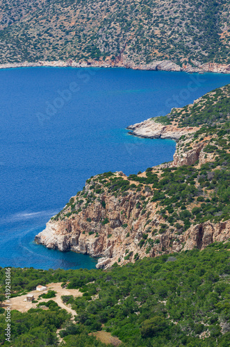 Beautiful sea bay and rocky coast covered with green trees (Rhodes, Greece)