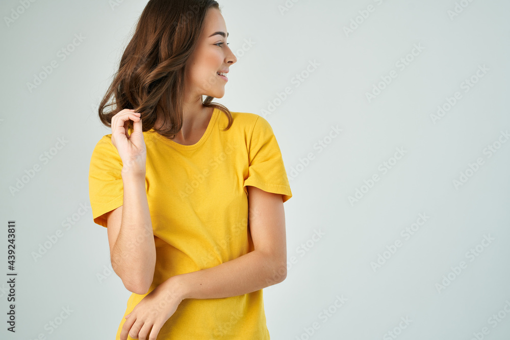 cheerful brunette in yellow t-shirt fashion hairstyle glamor cropped view studio cheerful brunette in yellow t-shirt fashion hairstyle glamor cropped view studio