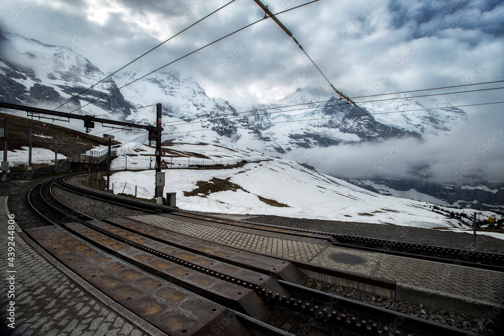 View along the railway from Interlaken to Jungfraujoch In cloudy day at Switzerland