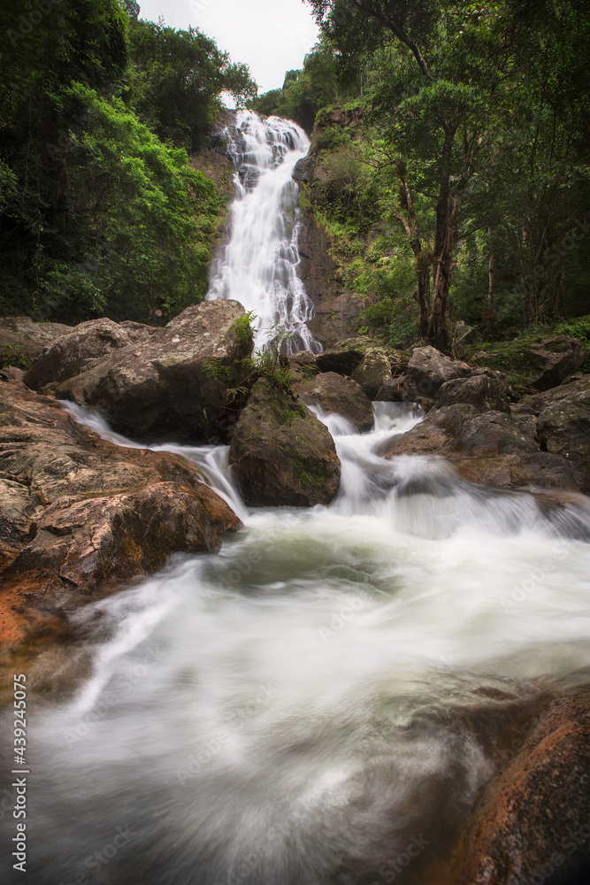 Fototapeta premium Beautiful Waterfall in Thailand. River stream flowing over rock formations in the mountains