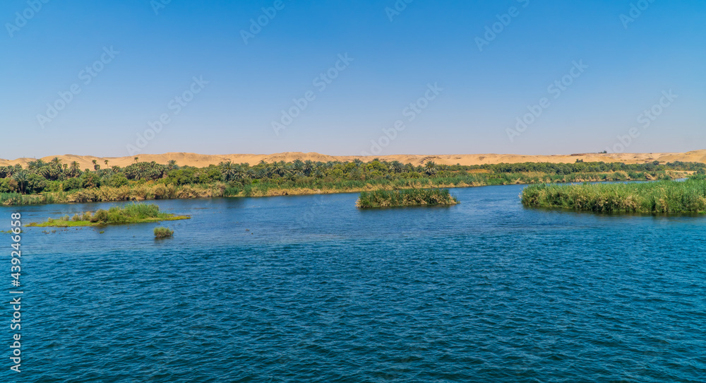 Panoramic view of fertile vegetation along the banks of the Nile River near Edfu, Egypt Panoramic view of fertile vegetation along the banks of the Nile River near Edfu, Egypt