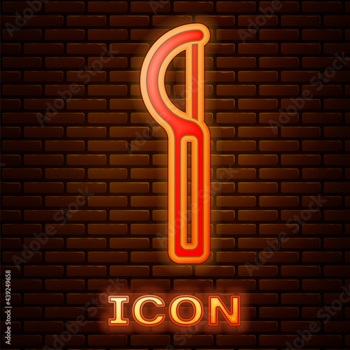 Glowing neon Dental floss icon isolated on brick wall background. Vector