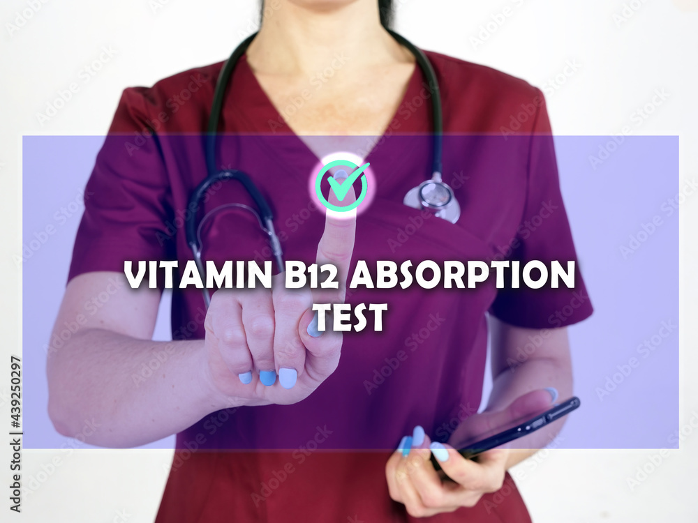 VITAMIN B12 ABSORPTION TEST text in menu. Modern therapeutic looking for something at cellphone. VITAMIN B12 ABSORPTION TEST text in menu. Modern therapeutic looking for something at cellphone.
