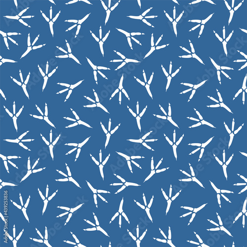 Seamless pattern with footprint of a bird. Vector seamless background with a pattern of traces of bird steps. Raven footprints seamless pattern. Footprints in the blue snow. Fabric textile print