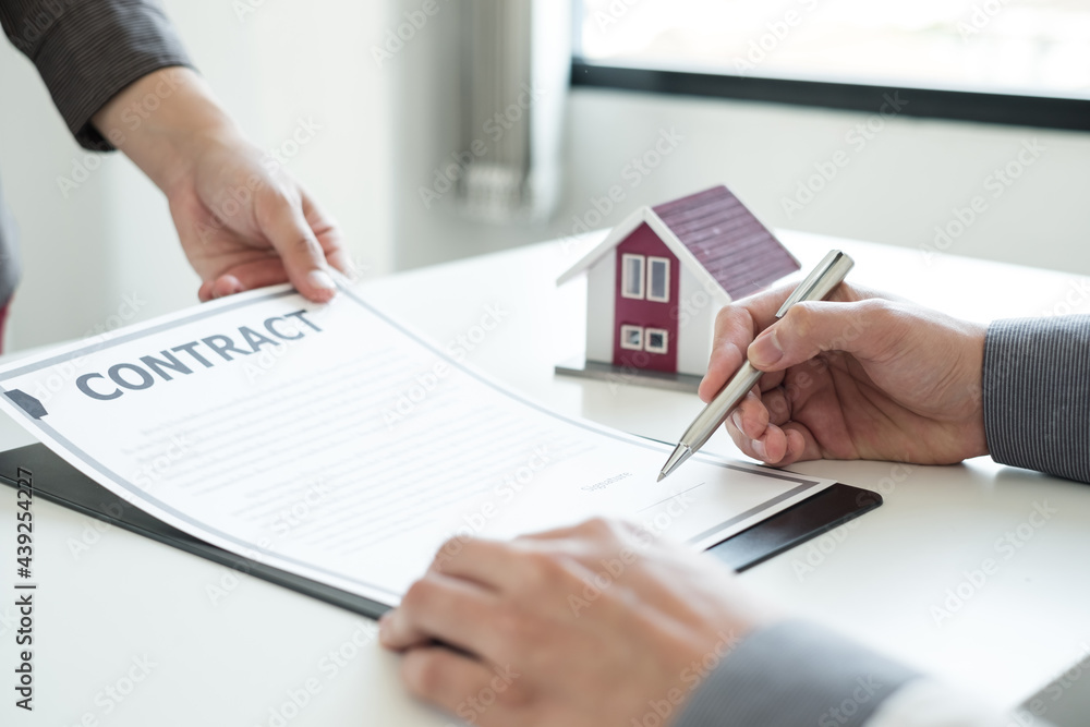 Real estate agents offer sale home insurance and close the sale