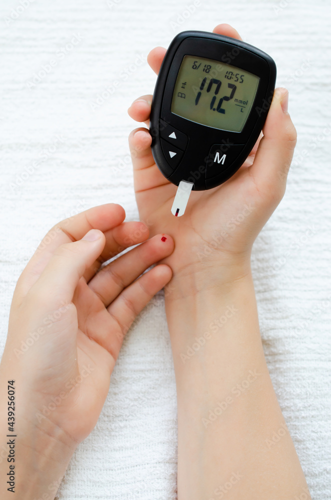 custom made wallpaper toronto digitalDiabetes test. Child hands checking blood sugar level by Glucose meter.