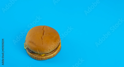 Delicious burger on blue background