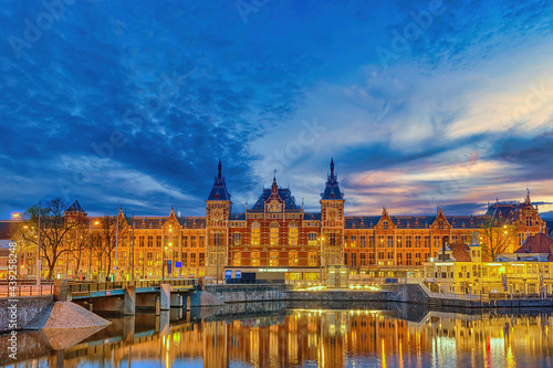 Amsterdam Netherlands, night city skyline at Amsterdam Central Station