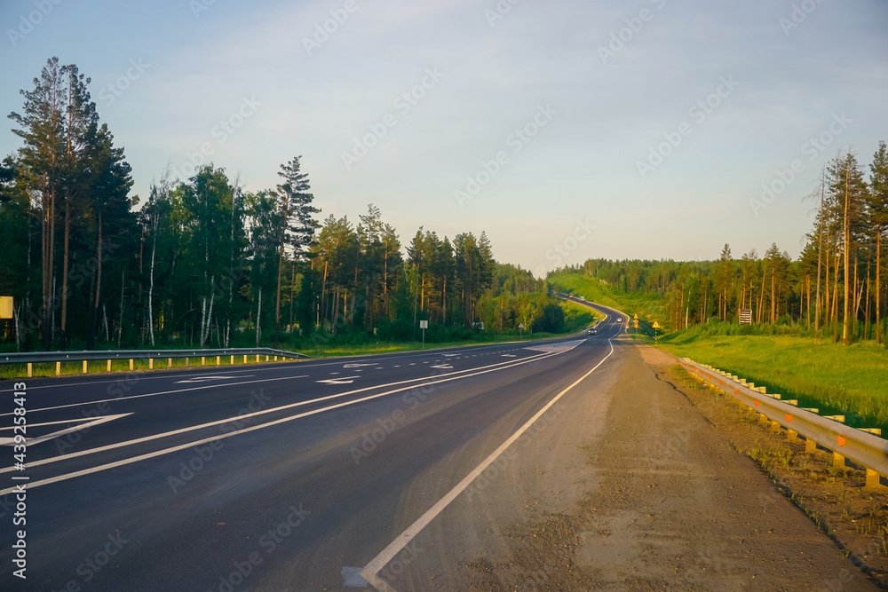 Fototapeta premium Road in Siberia at sunset