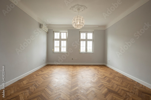 Interior of an empty apartment with wooden parquet © rilueda