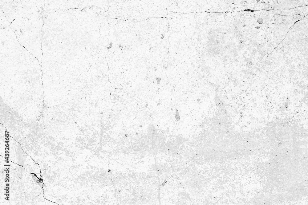 Old cracked white concrete wall texture. Light cement surface abstract background