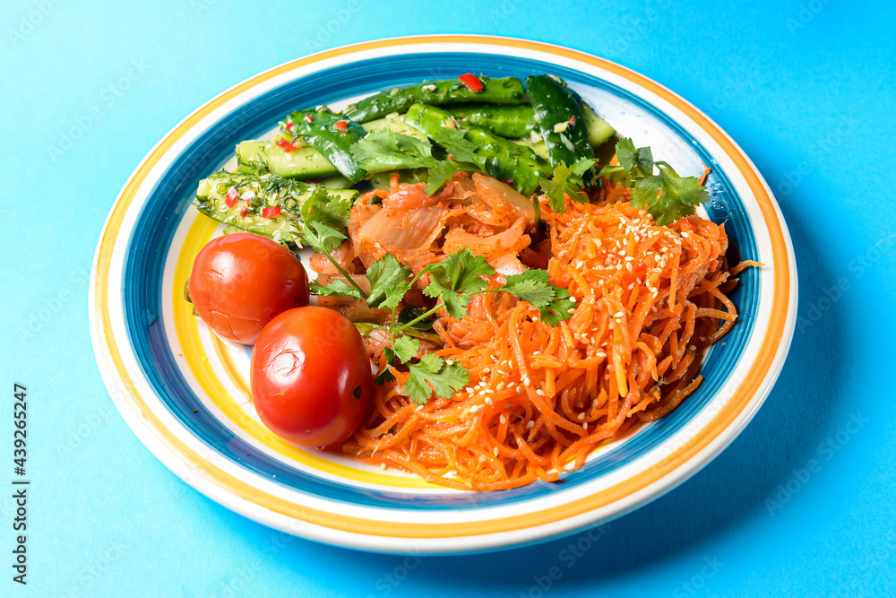 Fresh vegetable salad made of cabagge, carrot, cucumbers and tomatoes with fresh greenery. Fresh vegetable salad made of cabagge, carrot, cucumbers and tomatoes with fresh greenery.