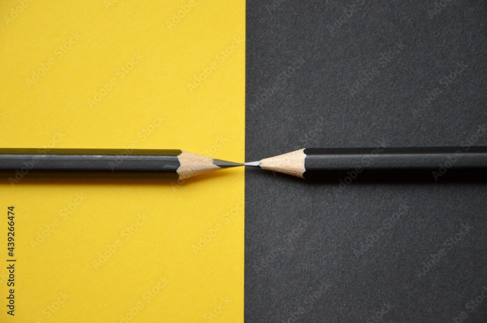 Overhead photo of two black pens Overhead photo of two black pens