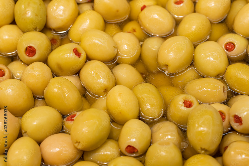 Close-up green olives with pepper filling Close-up green olives with pepper filling