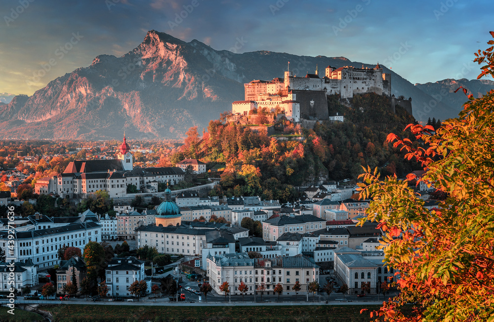 Fototapeta premium Colorful morning cityscape. Stunning view on historic city of Salzburg with famous Hohensalzburg Fortress. Wonderful autumn landscape with picturesque sky. Softlight effect. Salzburger Land, Austria