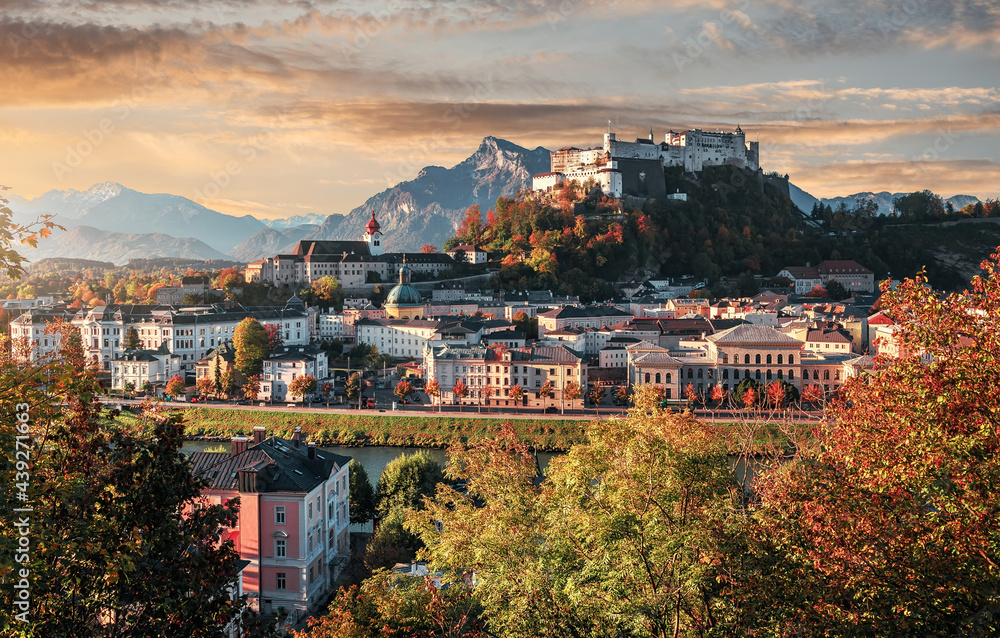 Wonderful view on iconic view of the historic city of Salzburg with famous Hohensalzburg Fortress. Amazing landscape with picturesque sky during sunset. Salzburger Land, Austria