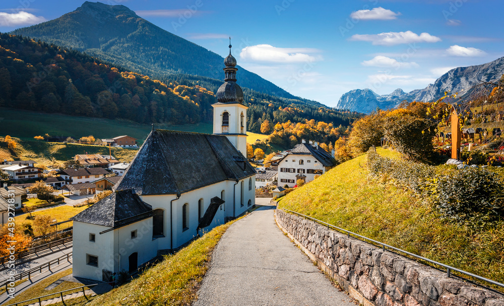 Amazing nature landscape. Famous St. Sebastian Church at sunny day in autumn at Berchtesgadener Land, Bavaria, Germany. Concept of an ideal resting place. Popular travel destination. Autumn scenery