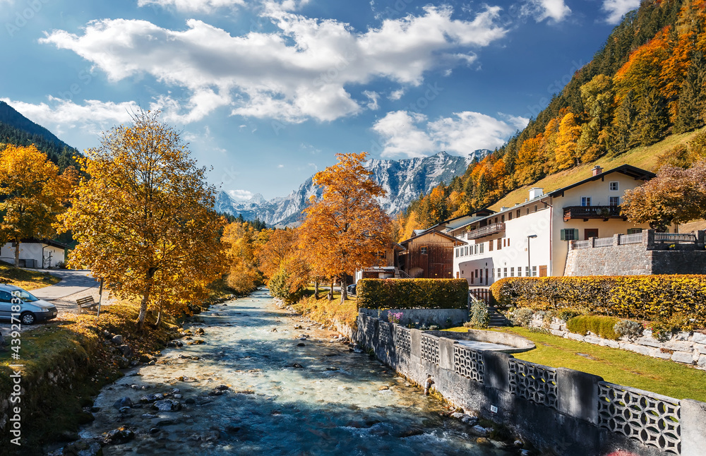 Stunning nature landscape. Beautiful colorful autumn scenery with a stream and forest. Amazing sunny day on the mountain river. concept of an ideal resting place. Parish Church of St. Sebastian