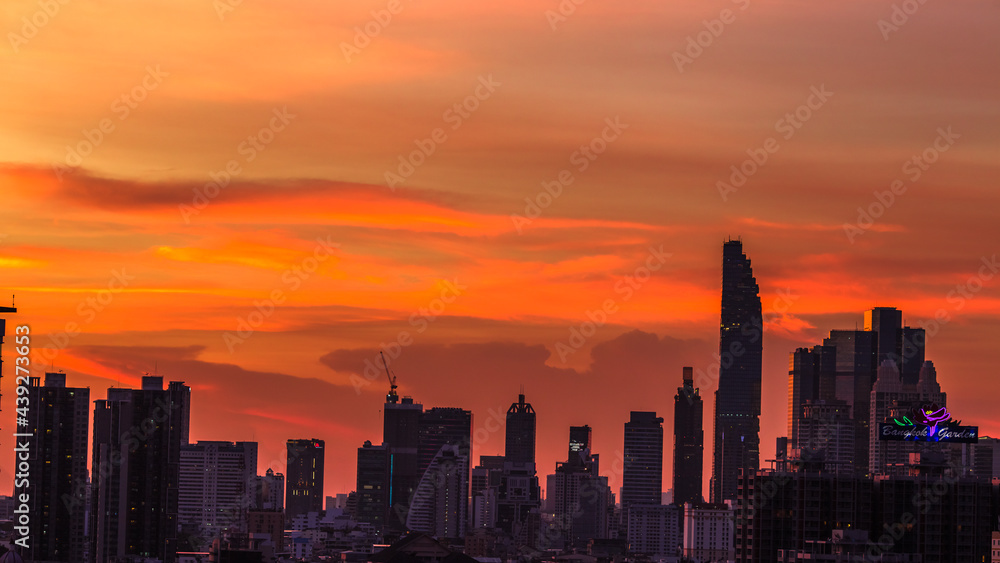 The high angle background of the city view with the secret light of the evening, blurring of night lights, showing the distribution of condominiums, dense homes in the capital community