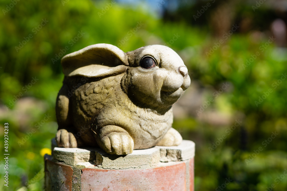 garden porcelain rabbit figurine as garden decoration.