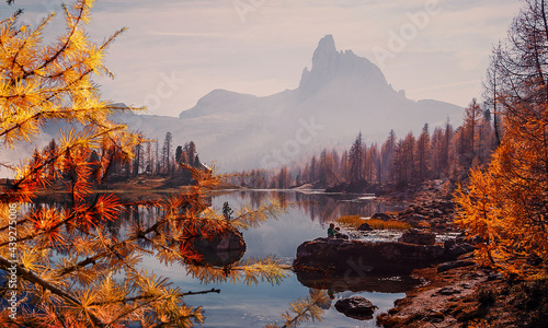 Fantastic Wild nature scenery of Dolomites Alps. Mountain landscape with perfect reflection, picturesque mountain lake in the summer morning. Beautiful landscape background. Federa lake. Dolomiti.
