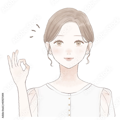 OKサインを出す女性