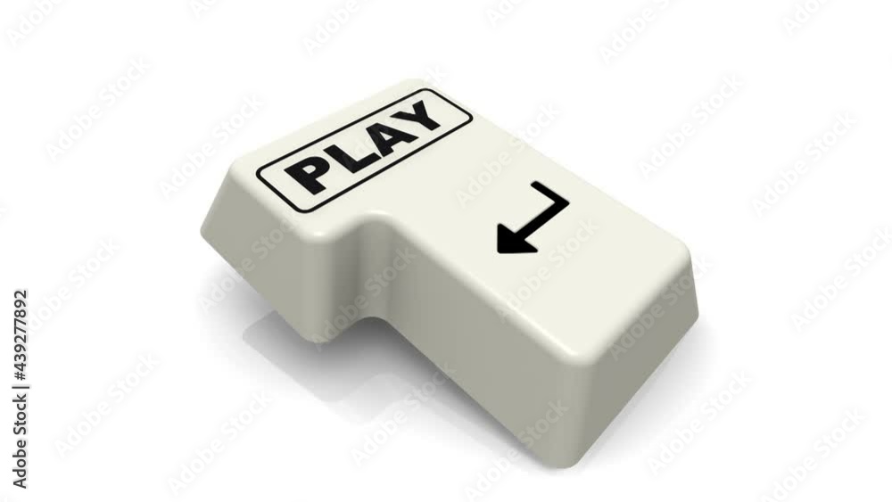 The enter key with the word PLAY. The computer Enter key with the word PLAY on a white surface in action. Footage video The enter key with the word PLAY. The computer Enter key with the word PLAY on a white surface in action. Footage video