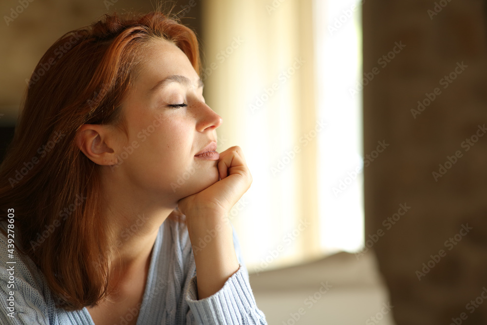 Relaxed woman resting with closed eyes at home Relaxed woman resting with closed eyes at home