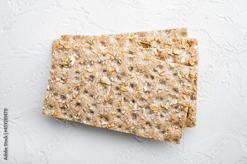 Crunchy crispbread Healthy snack, on white stone table background, top view flat lay photo