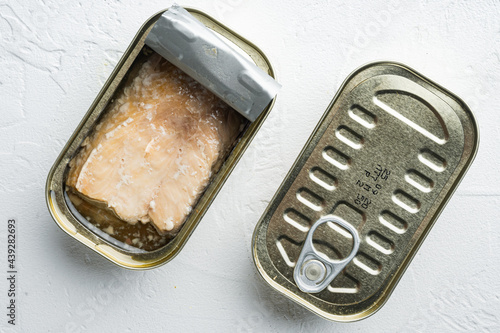 Canned Wild Alaska Salmon, in tin can, on white background, top view flat lay